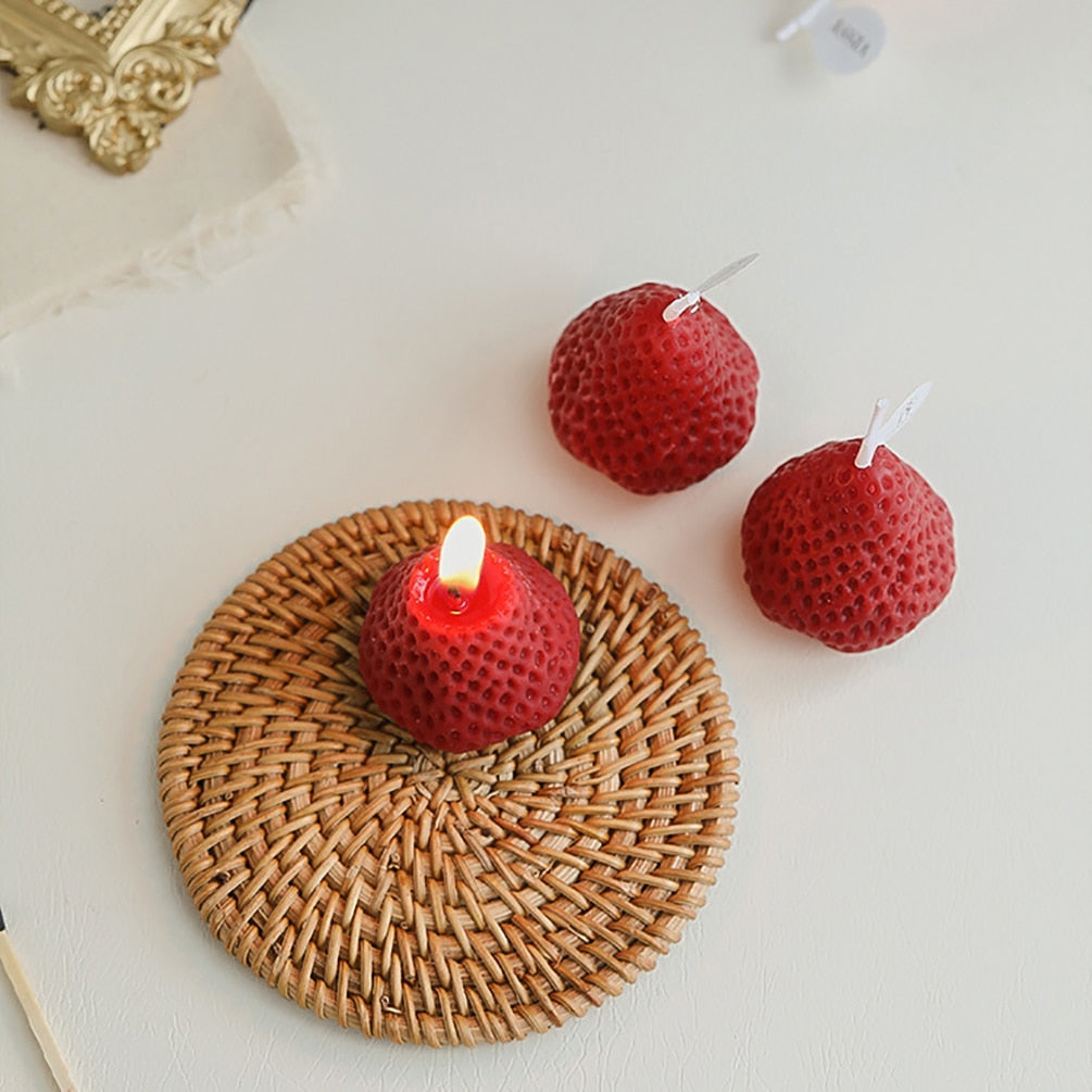 Red lit strawberry shape candles