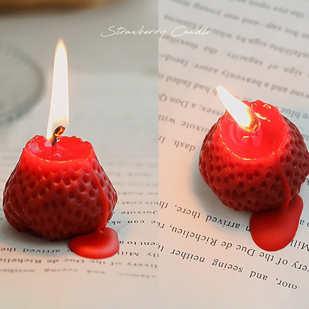 Red lit strawberry shape candles